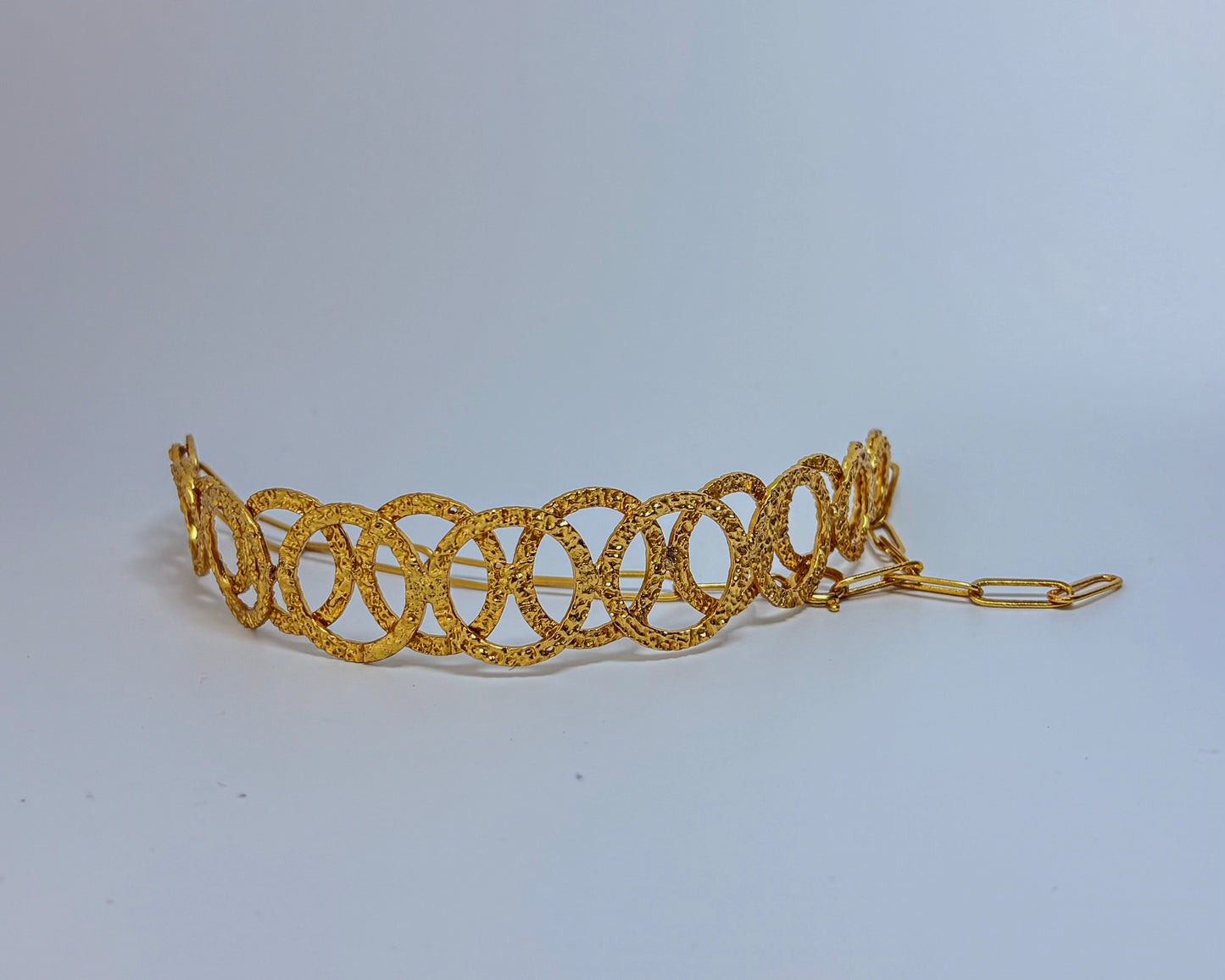 Model wearing a handcrafted gold-toned choker necklace with interlocking oval loops – statement semi-fine jewelry by Adiva Jewelry