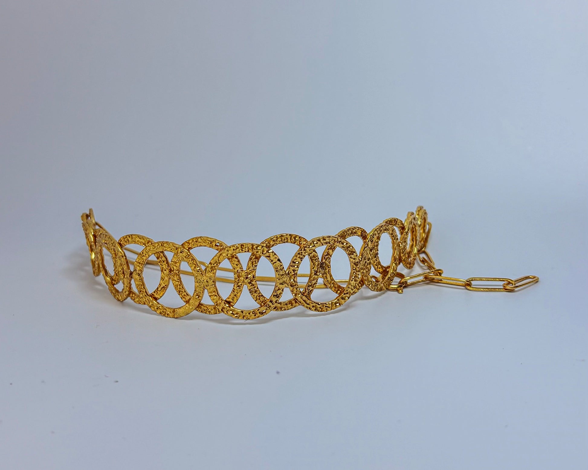 Model wearing a handcrafted gold-toned choker necklace with interlocking oval loops – statement semi-fine jewelry by Adiva Jewelry