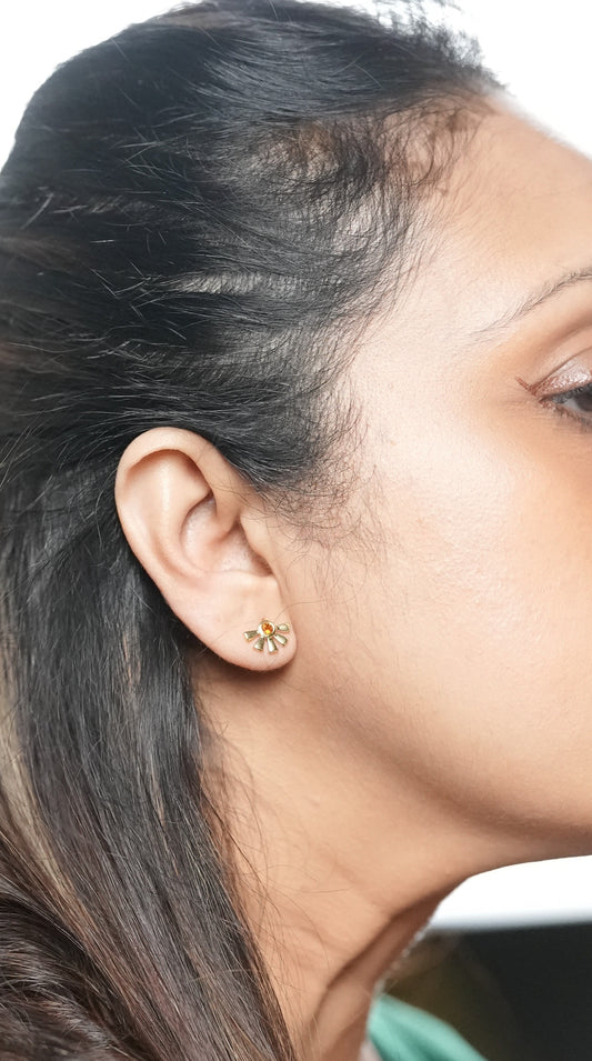 Woman wearing flower petal studs and getting ready to go to office - earrings made by Adiva Jewelry