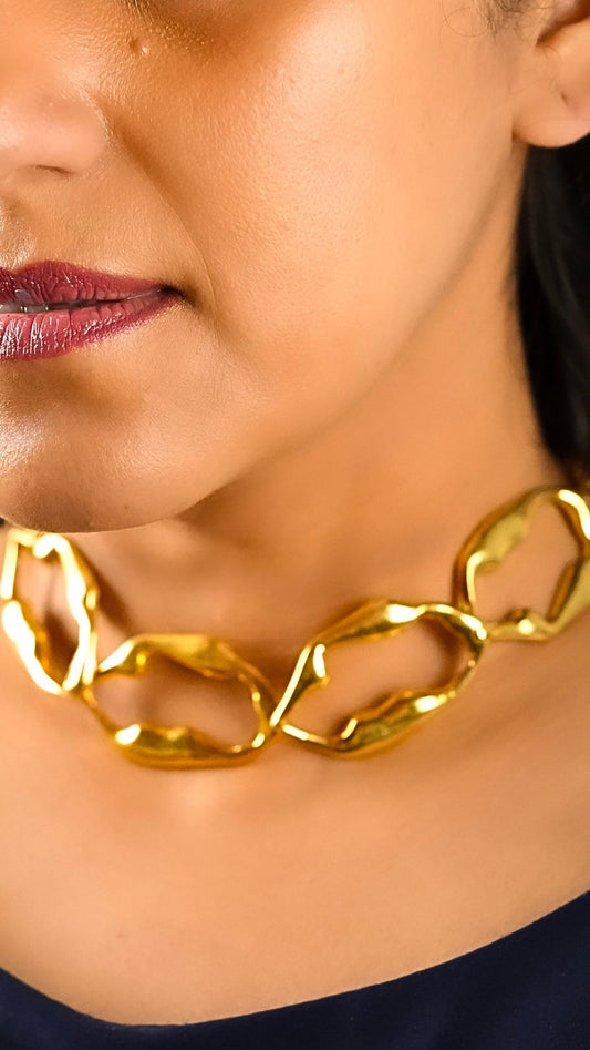 Close up of a woman wearing the Aria necklace of Adiva jewelry with a formal dress