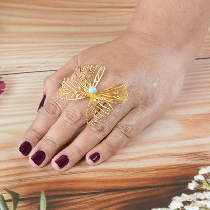 Brass butterfly statement ring with turquoise accent by Adiva Jewelry — the perfect bold accessory for a brunch date with the girls or adding charm to a first date look.