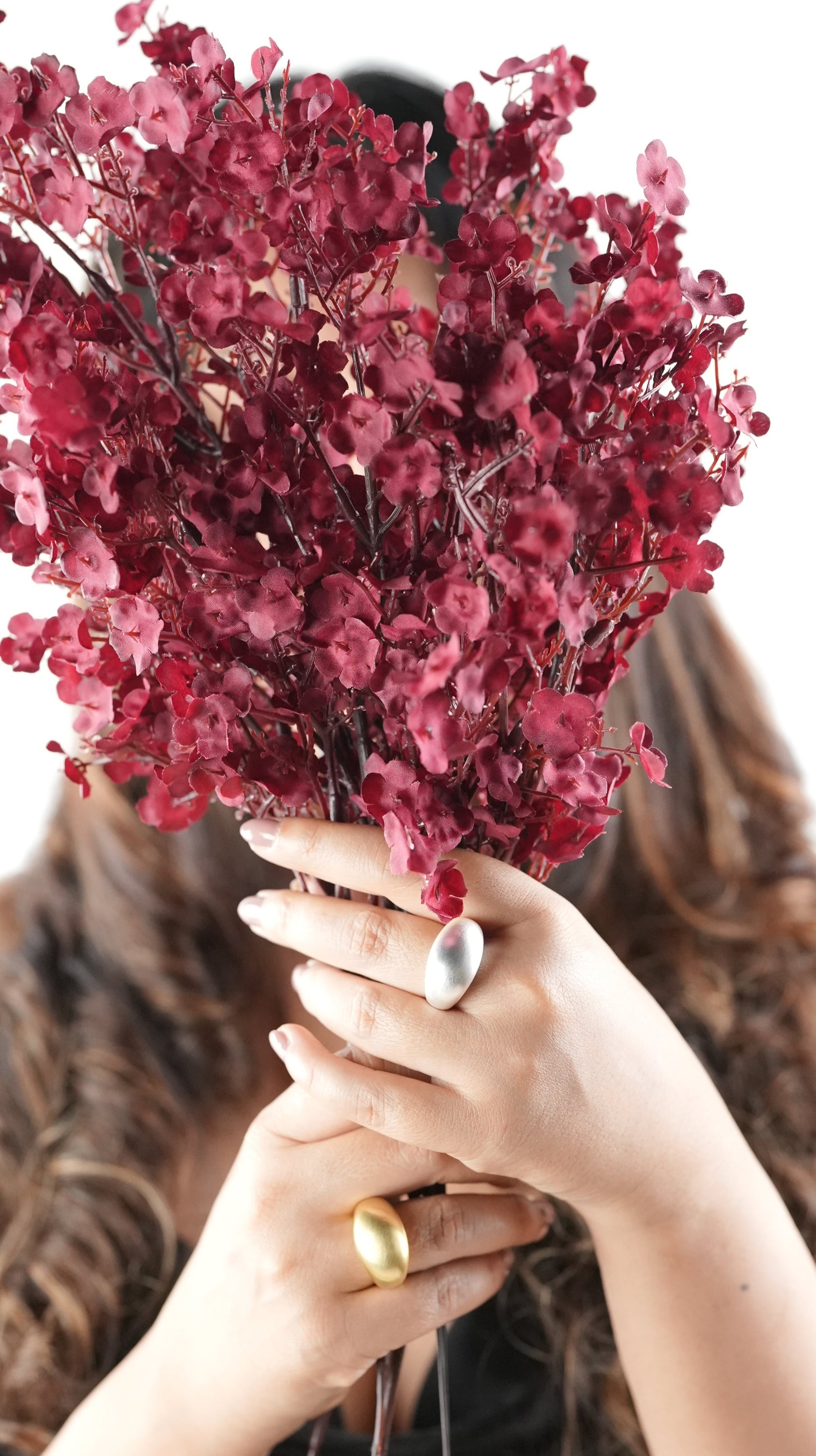 Bold matte silver statement ring on woman’s hand holding a bouquet of flowers – sculptural dome design, minimalist jewelry for modern women – Adiva Jewelry