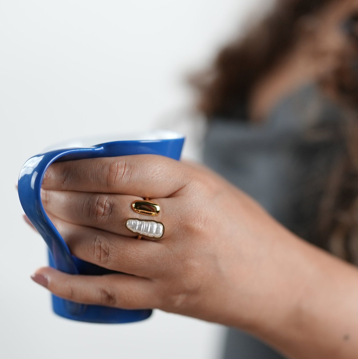 Statement open band ring with dual accents — polished gold-tone and textured pearl-inspired detail — styled by Adiva Jewelry, a modern lifestyle jewelry brand