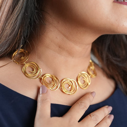 Gold-toned handcrafted spiral necklace in brass base – a bold, contemporary piece from Adiva Jewelry, ideal for everyday luxury, festive styling, or sustainable gifting
