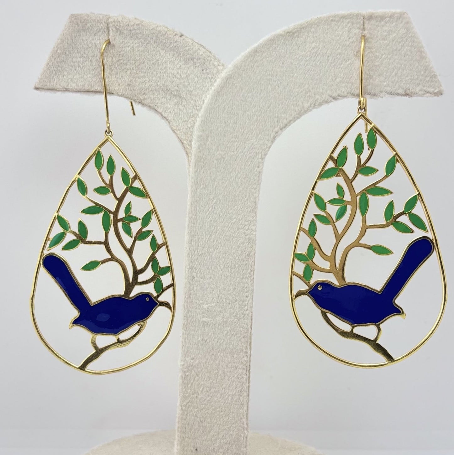 Handcrafted gold-toned statement earrings featuring a blue bird and tree motif – perfect party wear or a unique gifting choice from Adiva Jewelry